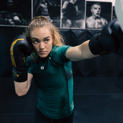 True Grit women's green BJJ rashguard — compression fit for grappling and MMA training