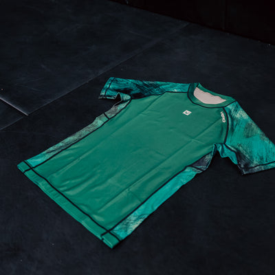 True Grit women's green BJJ rashguard — compression fit for grappling and MMA training — view 2