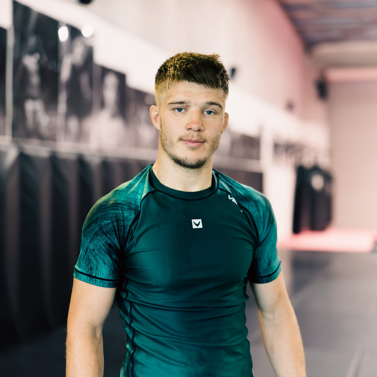 True Grit men's green BJJ rashguard — compression fit for grappling and MMA training